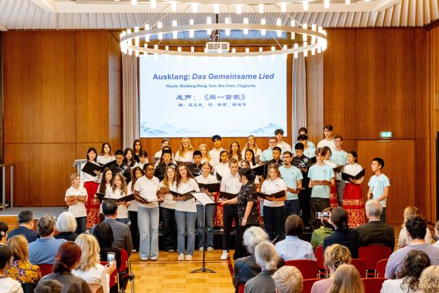 (261004) -- ESSEN, Oct. 4, 2026 (Xinhua) -- Students perform during a youth exchange concert in Essen, Germany, Oct. 3, 2026. Chinese and German students took the stage together on Saturday in the western German city of Essen for a youth exchange concert aimed at fostering cultural understanding and friendship through music.
   TO GO WITH "Chinese, German youth build ties through music at exchange concert" (Germany's Burg Chinese Chorus/Handout via Xinhua)