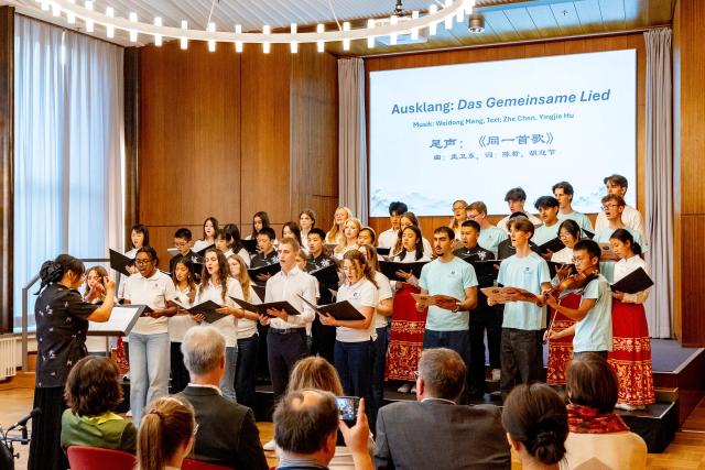 (261004) -- ESSEN, Oct. 4, 2026 (Xinhua) -- Students perform during a youth exchange concert in Essen, Germany, Oct. 3, 2026. Chinese and German students took the stage together on Saturday in the western German city of Essen for a youth exchange concert aimed at fostering cultural understanding and friendship through music.
   TO GO WITH "Chinese, German youth build ties through music at exchange concert" (Germany's Burg Chinese Chorus/Handout via Xinhua)