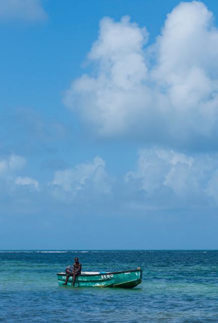 (261004) -- MALINDI, Oct. 4, 2026 (Xinhua) -- A fisherman rests on a fishing boat on the sea in Malindi, Kilifi County, Kenya, Oct. 4, 2026. Malindi, located on Kenya's southeastern coast along the Indian Ocean, is a historic city in Kilifi County and one of East Africa's well-known coastal tourist destinations. (Xinhua/Xie Jianfei)