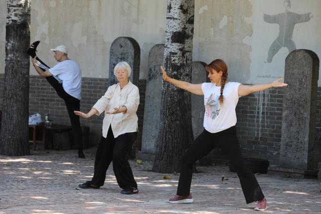 (261004) -- WENXIAN, Oct. 4, 2026 (Xinhua) -- Foreign Taijiquan enthusiasts practice Taijiquan at a Taijiquan school in Chenjiagou Village of Wenxian County, central China's Henan Province, Sept. 3, 2026. Social media users in the West have recently embraced "Chinamaxxing," in which young people show interest in aspects of Chinese daily life.
   Taijiquan, a kind of traditional martial arts, was born in the mid-17th century in Chenjiagou Village. Rooted in Chinese philosophy, traditional medicine and martial arts, Taijiquan has evolved into a wide range of styles and is now practiced in more than 180 countries and regions. For foreign visitors, Chenjiagou is naturally one of the best spots to experience the "Chinamaxxing" trend. The small village offers a tranquil and comfortable living environment which lets visitors get away from the busy pace of city life and immerse themselves in traditional Chinese culture. (Photo by Xu Hongxing/Xinhua)