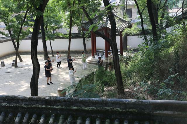 (261004) -- WENXIAN, Oct. 4, 2026 (Xinhua) -- Joseph Dauey (1st L, front), a Taijiquan enthusiast from Britain, practices Taijiquan in Chenjiagou Village of Wenxian County, central China's Henan Province, Aug. 26, 2026. Social media users in the West have recently embraced "Chinamaxxing," in which young people show interest in aspects of Chinese daily life.
   Taijiquan, a kind of traditional martial arts, was born in the mid-17th century in Chenjiagou Village. Rooted in Chinese philosophy, traditional medicine and martial arts, Taijiquan has evolved into a wide range of styles and is now practiced in more than 180 countries and regions. For foreign visitors, Chenjiagou is naturally one of the best spots to experience the "Chinamaxxing" trend. The small village offers a tranquil and comfortable living environment which lets visitors get away from the busy pace of city life and immerse themselves in traditional Chinese culture. (Photo by Xu Hongxing/Xinhua)