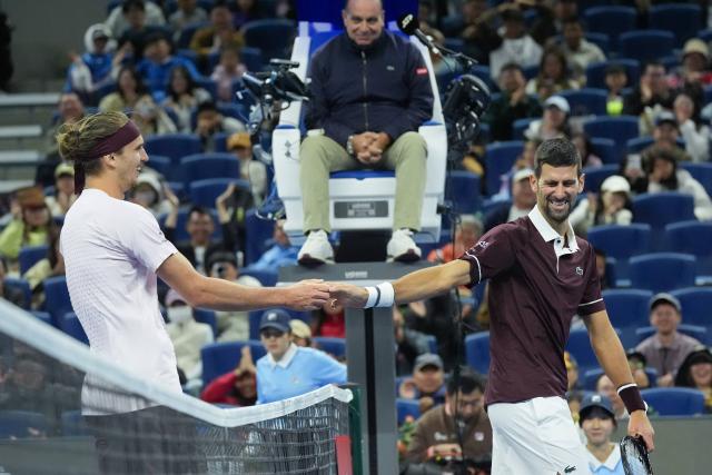 (261004) -- BEIJING, Oct. 4, 2026 (Xinhua) -- Alexander Zverev (L) greets with Novak Djokovic after the men's singles quarterfinal match between Alexander Zverev of Germany and Novak Djokovic of Serbia at 2026 China Open tennis tournament in Beijing, China, Oct. 4, 2026. (Xinhua/Ju Huanzong)