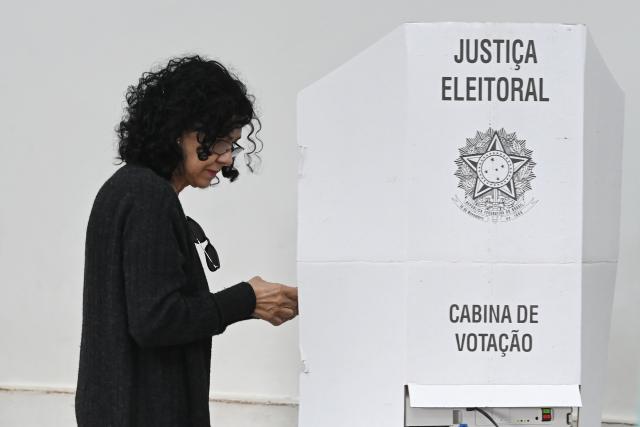 (261004) -- BRASILIA, Oct. 4, 2026 (Xinhua) -- A voter casts her ballot at a polling station in Brasilia, Brazil, Oct. 4, 2026. Voting in the first round of Brazil's 2026 presidential election officially began at 8 a.m. (1100 GMT) on Sunday, with polling stations across the country scheduled to close at 5 p.m. (0800 GMT).
   Initial results are expected to be announced within a few hours after the polls close. (Photo by Lucio Tavora/Xinhua)