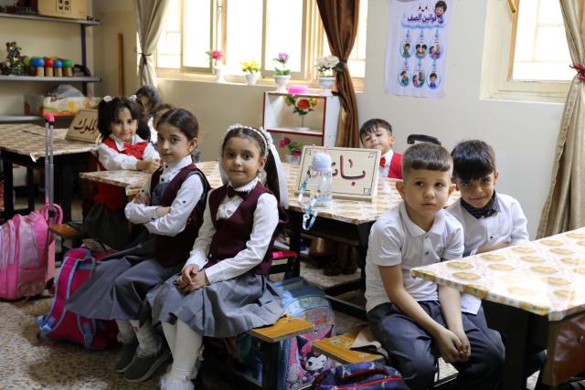 (261004) -- BAGHDAD, Oct. 4, 2026 (Xinhua) -- Primary school students attend class on the first day of new academic year in Baghdad, Iraq, Oct. 4, 2026. The new academic year officially began in schools across Iraq on Sunday. (Xinhua/Khalil Dawood)
