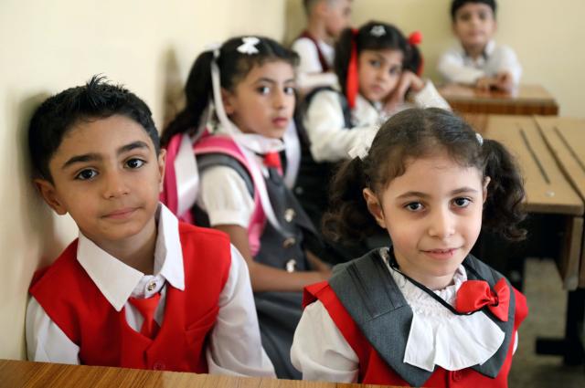 (261004) -- BAGHDAD, Oct. 4, 2026 (Xinhua) -- Primary school students attend class on the first day of new academic year in Baghdad, Iraq, Oct. 4, 2026. The new academic year officially began in schools across Iraq on Sunday. (Xinhua/Khalil Dawood)