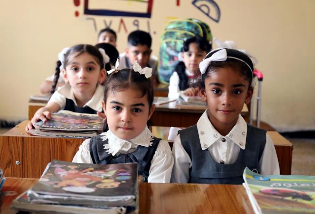 (261004) -- BAGHDAD, Oct. 4, 2026 (Xinhua) -- Primary school students attend class on the first day of new academic year in Baghdad, Iraq, Oct. 4, 2026. The new academic year officially began in schools across Iraq on Sunday. (Xinhua/Khalil Dawood)