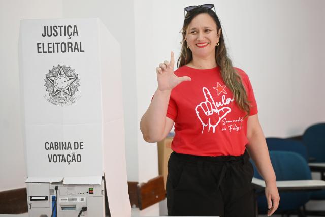 (261004) -- BRASILIA, Oct. 4, 2026 (Xinhua) -- A voter poses after casting her ballot at a polling station in Brasilia, Brazil, Oct. 4, 2026. Voting in the first round of Brazil's 2026 presidential election officially began at 8 a.m. (1100 GMT) on Sunday, with polling stations across the country scheduled to close at 5 p.m. (0800 GMT). Initial results are expected to be announced within a few hours after the polls close. (Photo by Lucio Tavora/Xinhua)