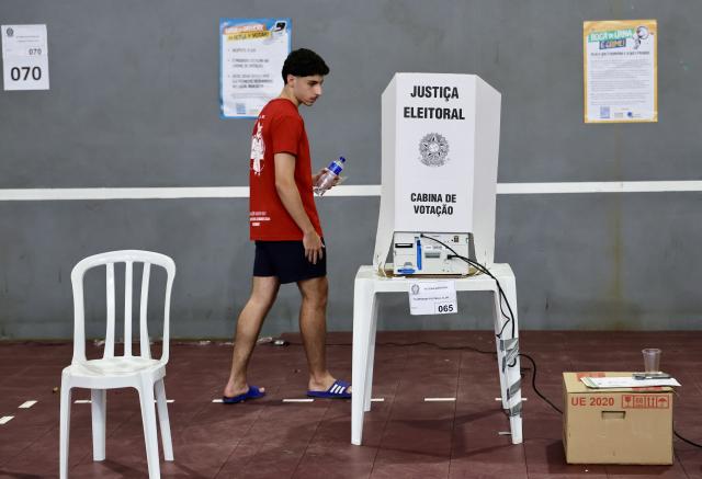 (261004) -- RIO DE JANEIRO, Oct. 4, 2026 (Xinhua) -- A voter prepares to cast his ballot at a polling station in Rio de Janeiro, Brazil, Oct. 4, 2026. Voting in the first round of Brazil's 2026 presidential election officially began at 8 a.m. (1100 GMT) on Sunday, with polling stations across the country scheduled to close at 5 p.m. (0800 GMT). Initial results are expected to be announced within a few hours after the polls close. (Xinhua/Jin Haoyuan)