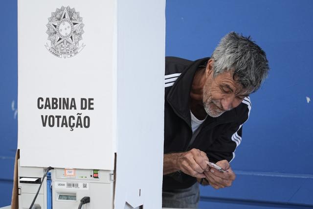 (261004) -- SAO PAULO, Oct. 4, 2026 (Xinhua) -- A voter prepares to cast his ballot at a polling station in Sao Bernardo do Campo, Sao Paulo state, Brazil, Oct. 4, 2026. Voting in the first round of Brazil's 2026 presidential election officially began at 8 a.m. (1100 GMT) on Sunday, with polling stations across the country scheduled to close at 5 p.m. (0800 GMT). Initial results are expected to be announced within a few hours after the polls close. (Photo by Paulo Lopes/Xinhua)