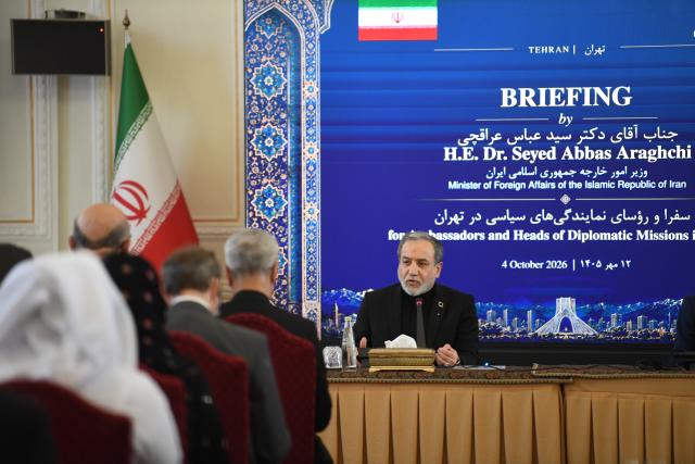 (261004) -- TEHRAN, Oct. 4, 2026 (Xinhua) -- Iran's Foreign Minister Seyed Abbas Araghchi speaks at a meeting with foreign ambassadors and diplomats in Tehran, Iran, on Oct. 4, 2026. Araghchi said on Sunday the country is still ready to achieve a "just and honorable" solution through diplomacy, but it will give a "more crushing" response if the "enemies" once again resort to military actions. (Xinhua/Shadati)