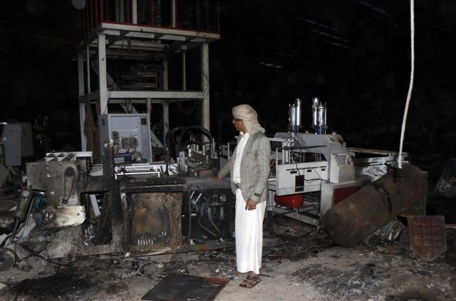 (261004) -- SANAA, Oct. 4, 2026 (Xinhua) -- A worker inspects a sponge factory after it was struck by an airstrike carried out by a Saudi warplane in Sanaa, Yemen, on Oct. 4, 2026. Yemen's Houthi group said Sunday that Saudi Arabia had launched 106 air and missile strikes across Houthi-held areas over the past 24 hours, as the internationally recognized government announced a new military campaign to retake territory from the group amid a widening escalation in the country. (Photo by Mohammed Mohammed/Xinhua)