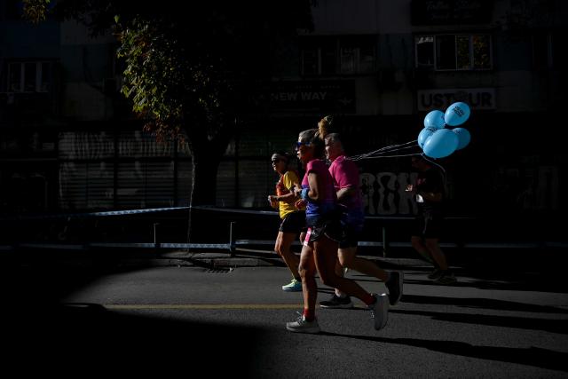(261005) -- SKOPJE, Oct. 5, 2026 (Xinhua) -- Participants compete during Skopje Marathon in Skopje, North Macedonia, Oct. 4, 2026. (Photo by Tomislav Georgiev/Xinhua)