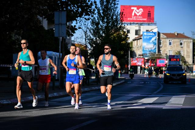 (261005) -- SKOPJE, Oct. 5, 2026 (Xinhua) -- Participants compete during Skopje Marathon in Skopje, North Macedonia, Oct. 4, 2026. (Photo by Tomislav Georgiev/Xinhua)