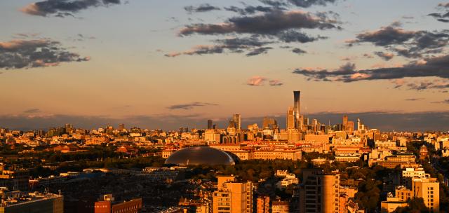 (261005) -- BEIJING, Oct. 5, 2026 (Xinhua) -- This photo taken on Oct. 4, 2026 shows the city skyline at sunset in Beijing, capital of China. (Xinhua/Wang Jianhua)
