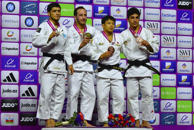 (261005) -- BAKU, Oct. 5, 2026 (Xinhua) -- Silver medallist Sherzod Davlatov of Kazakhstan, gold medallist Ahmad Yusifov of Azerbaijan, bronze medallists Nagayama Ryuju of Japan and Giorgi Sardalashvili of Georgia (from L to R) pose for photos during the awarding ceremony for the men's -60kg at the World Judo Championships 2026 in Baku, Azerbaijan, Oct. 4, 2026. (Xinhua/Chen Junfeng)