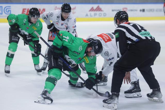 (261005) -- LJUBLJANA, Oct. 5, 2026 (Xinhua) -- Marly Quince (front L) of HK Olimpija battles for the puck against Blake Murray (front C) of Pioneers Vorarlberg during the 2026/27 ICE Hockey League match between HK Olimpija and Pioneers Vorarlberg at the Sports Hall Tivoli, Ljubljana, Slovenia, Oct 4, 2026. (Photo by Zeljko Stevanic/Xinhua)