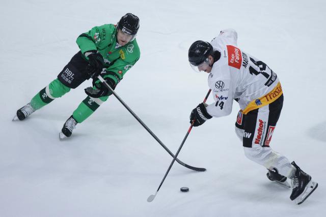 (261005) -- LJUBLJANA, Oct. 5, 2026 (Xinhua) -- Brycen Martin (R) of Pioneers Vorarlberg vies with Nicolai Meyer of HK Olimpija during the 2026/27 ICE Hockey League match between HK Olimpija and Pioneers Vorarlberg at the Sports Hall Tivoli, Ljubljana, Slovenia, Oct 4, 2026. (Photo by Zeljko Stevanic/Xinhua)