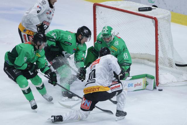 (261005) -- LJUBLJANA, Oct. 5, 2026 (Xinhua) -- Roni Allen (front R) of Pioneers Vorarlberg shoots during the 2026/27 ICE Hockey League match between HK Olimpija and Pioneers Vorarlberg at the Sports Hall Tivoli, Ljubljana, Slovenia, Oct 4, 2026. (Photo by Zeljko Stevanic/Xinhua)