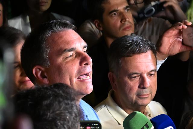 (261005) -- BRASILIA, Oct. 5, 2026 (Xinhua) -- Flavio Bolsonaro, presidential candidate of Brazil's Liberal Party, speaks after the announcement of the first-round results of the presidential election in Brasilia, Brazil, Oct. 4, 2026.
  Brazil will hold a presidential runoff on Oct. 25 as official results showed Sunday that no candidate secured a majority of valid votes in the first round.
  According to results released by the Superior Electoral Court, with over 99 percent of the ballots counted, Flavio Bolsonaro, presidential candidate of Brazil's Liberal Party, garnered about 47 percent of valid votes while incumbent President Luiz Inacio Lula da Silva of the Workers' Party came in second with about 45 percent.
  Under Brazil's electoral rules, a presidential candidate must secure more than half of the valid votes to win outright in the first round. Otherwise, the two candidates with the most votes advance to a runoff.
  Following the announcement of the first-round results, both candidates made remarks on Sunday night. (Xinhua/Lucio Tavora)