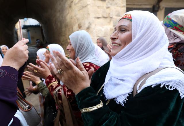 (261005) -- NABLUS, Oct. 5, 2026 (Xinhua) -- Palestinians wearing traditional attire are seen during a wedding ceremony in the West Bank city of Nablus, Oct. 3, 2026. (Photo by Ayman Nobani/Xinhua)