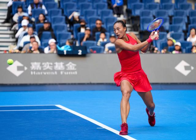 (261005) -- BEIJING, Oct. 5, 2026 (Xinhua) -- Zheng Qinwen of China hits a return during the women's singles round of 32 match against Marie Bouzkova of the Czech Republic at 2026 China Open tennis tournament in Beijing, China, Oct. 5, 2026. (Xinhua/Sun Fei)