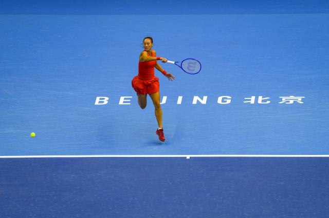 (261005) -- BEIJING, Oct. 5, 2026 (Xinhua) -- Zheng Qinwen of China hits a return during the women's singles round of 32 match against Marie Bouzkova of the Czech Republic at 2026 China Open tennis tournament in Beijing, China, Oct. 5, 2026. (Xinhua/Sun Fei)