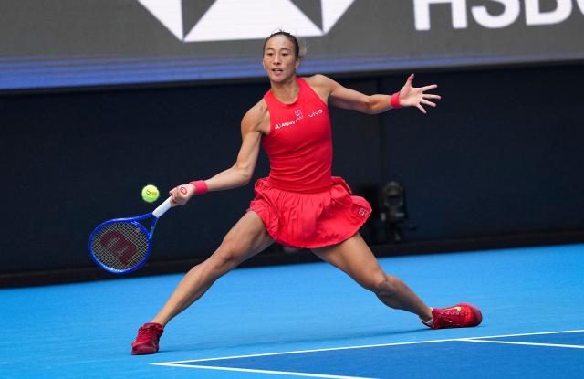 (261005) -- BEIJING, Oct. 5, 2026 (Xinhua) -- Zheng Qinwen of China hits a return during the women's singles round of 32 match against Marie Bouzkova of the Czech Republic at 2026 China Open tennis tournament in Beijing, China, Oct. 5, 2026. (Xinhua/Sun Fei)
