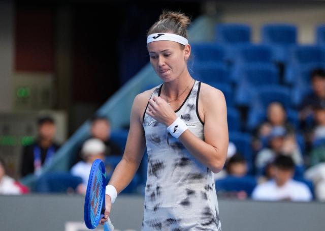 (261005) -- BEIJING, Oct. 5, 2026 (Xinhua) -- Marie Bouzkova of the Czech Republic reacts during the women's singles round of 32 match against Zheng Qinwen of China at 2026 China Open tennis tournament in Beijing, China, Oct. 5, 2026. (Xinhua/Sun Fei)