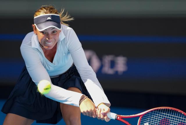 (261005) -- BEIJING, Oct. 5, 2026 (Xinhua) -- Donna Vekic of Croatia hits a return during the women's singles round of 32 match against Iga Swiatek of Poland at 2026 China Open tennis tournament in Beijing, China, Oct. 5, 2026. (Xinhua/Sun Fei)