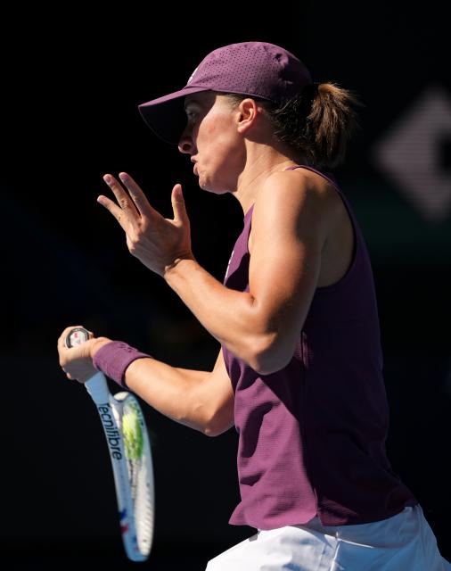 (261005) -- BEIJING, Oct. 5, 2026 (Xinhua) -- Iga Swiatek of Poland hits a return during the women's singles round of 32 match against Donna Vekic of Croatia at 2026 China Open tennis tournament in Beijing, China, Oct. 5, 2026. (Xinhua/Sun Fei)