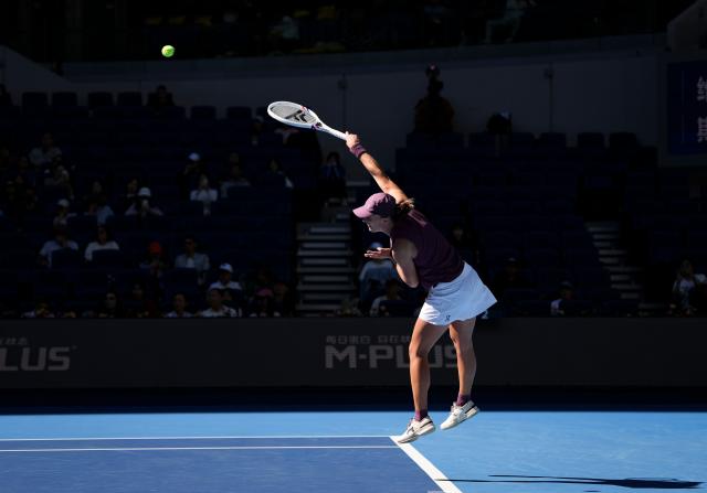(261005) -- BEIJING, Oct. 5, 2026 (Xinhua) -- Iga Swiatek of Poland serves during the women's singles round of 32 match against Donna Vekic of Croatia at 2026 China Open tennis tournament in Beijing, China, Oct. 5, 2026. (Xinhua/Sun Fei)