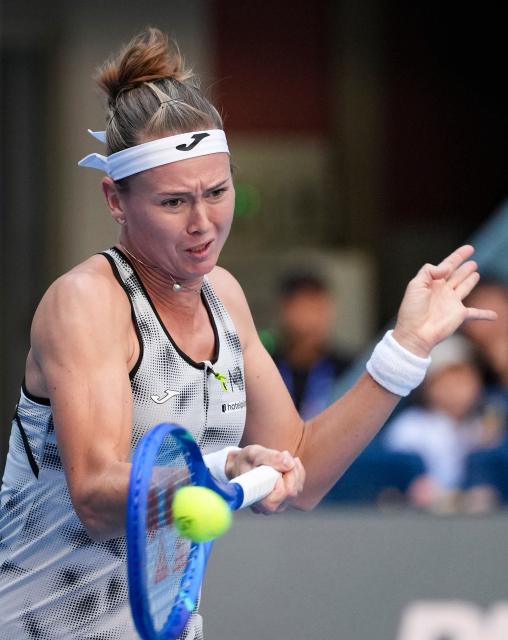(261005) -- BEIJING, Oct. 5, 2026 (Xinhua) -- Marie Bouzkova of the Czech Republic hits a return during the women's singles round of 32 match against Zheng Qinwen of China at 2026 China Open tennis tournament in Beijing, China, Oct. 5, 2026. (Xinhua/Sun Fei)