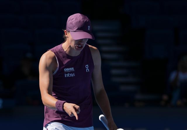(261005) -- BEIJING, Oct. 5, 2026 (Xinhua) -- Iga Swiatek of Poland reacts during the women's singles round of 32 match against Donna Vekic of Croatia at 2026 China Open tennis tournament in Beijing, China, Oct. 5, 2026. (Xinhua/Sun Fei)