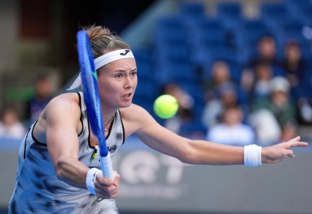 (261005) -- BEIJING, Oct. 5, 2026 (Xinhua) -- Marie Bouzkova of the Czech Republic hits a return during the women's singles round of 32 match against Zheng Qinwen of China at 2026 China Open tennis tournament in Beijing, China, Oct. 5, 2026. (Xinhua/Sun Fei)