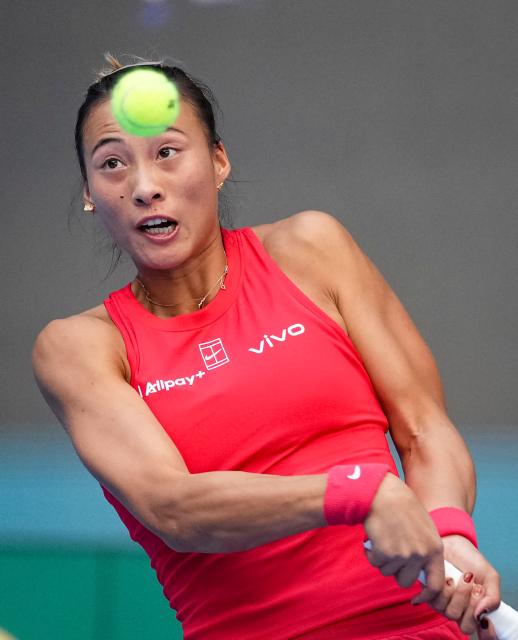 (261005) -- BEIJING, Oct. 5, 2026 (Xinhua) -- Zheng Qinwen of China hits a return during the women's singles round of 32 match against Marie Bouzkova of the Czech Republic at 2026 China Open tennis tournament in Beijing, China, Oct. 5, 2026. (Xinhua/Sun Fei)