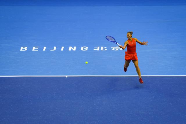 (261005) -- BEIJING, Oct. 5, 2026 (Xinhua) -- Zheng Qinwen of China hits a return during the women's singles round of 32 match against Marie Bouzkova of the Czech Republic at 2026 China Open tennis tournament in Beijing, China, Oct. 5, 2026. (Xinhua/Sun Fei)
