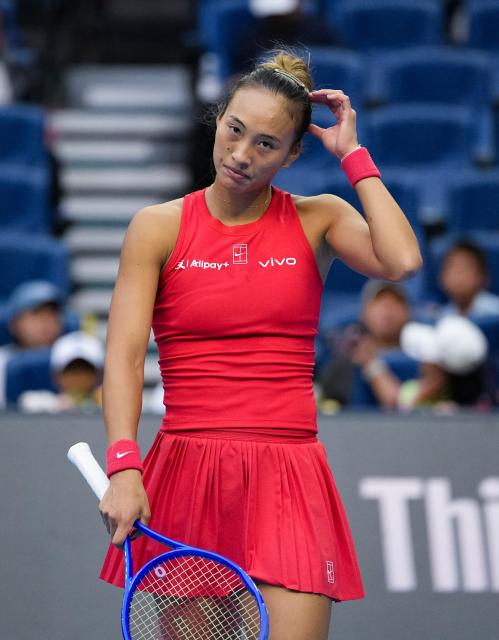 (261005) -- BEIJING, Oct. 5, 2026 (Xinhua) -- Zheng Qinwen of China reacts during the women's singles round of 32 match against Marie Bouzkova of the Czech Republic at 2026 China Open tennis tournament in Beijing, China, Oct. 5, 2026. (Xinhua/Sun Fei)