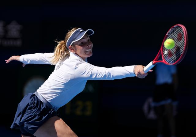 (261005) -- BEIJING, Oct. 5, 2026 (Xinhua) -- Donna Vekic of Croatia hits a return during the women's singles round of 32 match against Iga Swiatek of Poland at 2026 China Open tennis tournament in Beijing, China, Oct. 5, 2026. (Xinhua/Sun Fei)