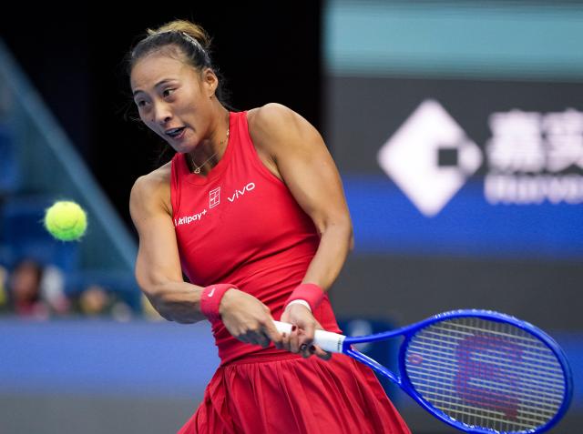 (261005) -- BEIJING, Oct. 5, 2026 (Xinhua) -- Zheng Qinwen of China hits a return during the women's singles round of 32 match against Marie Bouzkova of the Czech Republic at 2026 China Open tennis tournament in Beijing, China, Oct. 5, 2026. (Xinhua/Sun Fei)