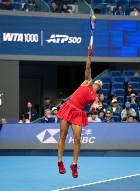 (261005) -- BEIJING, Oct. 5, 2026 (Xinhua) -- Zheng Qinwen of China hits a return during the women's singles round of 32 match against Marie Bouzkova of the Czech Republic at 2026 China Open tennis tournament in Beijing, China, Oct. 5, 2026. (Xinhua/Sun Fei)