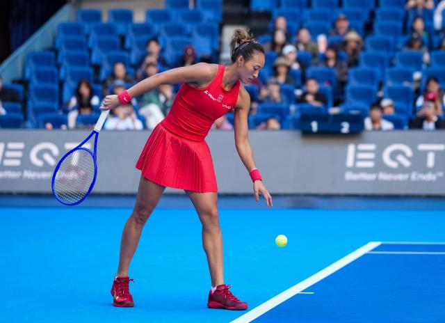 (261005) -- BEIJING, Oct. 5, 2026 (Xinhua) -- Zheng Qinwen of China prepares to serve during the women's singles round of 32 match against Marie Bouzkova of the Czech Republic at 2026 China Open tennis tournament in Beijing, China, Oct. 5, 2026. (Xinhua/Sun Fei)