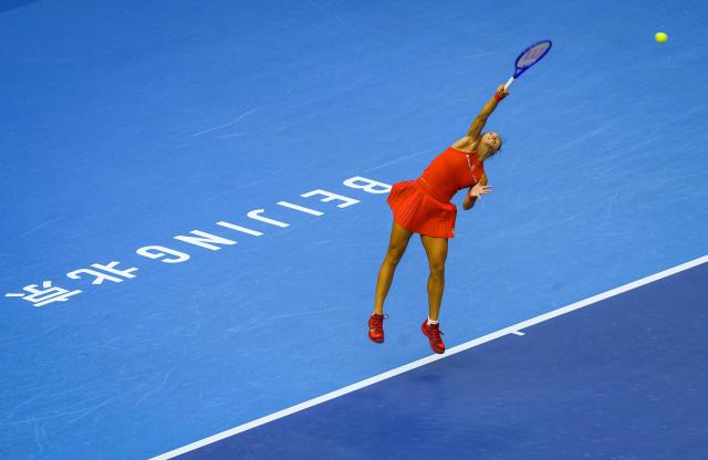 (261005) -- BEIJING, Oct. 5, 2026 (Xinhua) -- Zheng Qinwen of China serves during the women's singles round of 32 match against Marie Bouzkova of the Czech Republic at 2026 China Open tennis tournament in Beijing, China, Oct. 5, 2026. (Xinhua/Sun Fei)