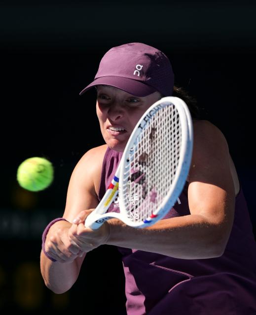 (261005) -- BEIJING, Oct. 5, 2026 (Xinhua) -- Iga Swiatek of Poland hits a return during the women's singles round of 32 match against Donna Vekic of Croatia at 2026 China Open tennis tournament in Beijing, China, Oct. 5, 2026. (Xinhua/Sun Fei)