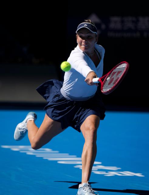 (261005) -- BEIJING, Oct. 5, 2026 (Xinhua) -- Donna Vekic of Croatia hits a return during the women's singles round of 32 match against Iga Swiatek of Poland at 2026 China Open tennis tournament in Beijing, China, Oct. 5, 2026. (Xinhua/Sun Fei)