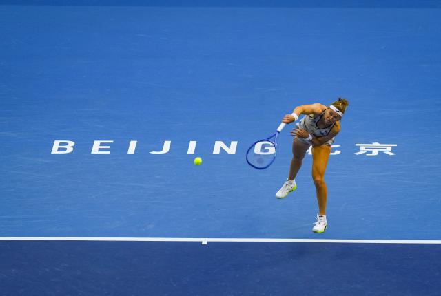 (261005) -- BEIJING, Oct. 5, 2026 (Xinhua) -- Marie Bouzkova of the Czech Republic hits a return during the women's singles round of 32 match against Zheng Qinwen of China at 2026 China Open tennis tournament in Beijing, China, Oct. 5, 2026. (Xinhua/Sun Fei)