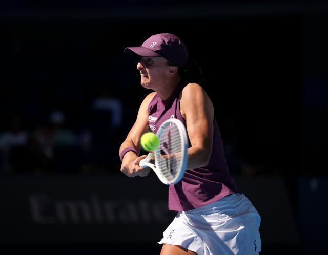 (261005) -- BEIJING, Oct. 5, 2026 (Xinhua) -- Iga Swiatek of Poland hits a return during the women's singles round of 32 match against Donna Vekic of Croatia at 2026 China Open tennis tournament in Beijing, China, Oct. 5, 2026. (Xinhua/Sun Fei)