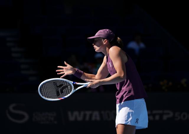 (261005) -- BEIJING, Oct. 5, 2026 (Xinhua) -- Iga Swiatek of Poland reacts during the women's singles round of 32 match against Donna Vekic of Croatia at 2026 China Open tennis tournament in Beijing, China, Oct. 5, 2026. (Xinhua/Sun Fei)