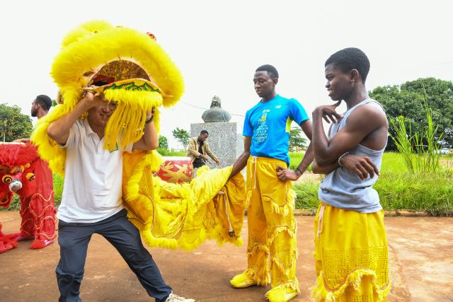 (261005) -- SOA, Oct. 5, 2026 (Xinhua) -- Chinese teacher Dong Chenglin (L front) introduces Chinese lion dance culture to local students at the Confucius Institute at the University of Yaounde II in Soa, Cameroon, Sept. 29, 2026. October 5 marks World Teachers' Day. Over the years, Confucius Institutes across Africa have actively promoted Chinese language education and cultural exchange, playing an important role in fostering mutual learning between China and African countries and strengthening friendship between the Chinese and African peoples. (Xinhua/Kepseu)