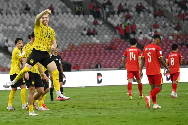 (261005) -- JAKARTA, Oct. 5, 2026 (Xinhua) -- Fergus Tierney (3rd L) of Malaysia celebrates after scoring during the FIFA ASEAN Cup 2026 Division 1 Bronze Final Match between Malaysia and Vietanm at Gelora Bung Karno Stadium in Jakarta, Indonesia, Oct. 5, 2026. (Xinhua/Agung Kuncahya B.)