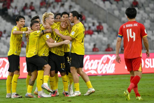 (261005) -- JAKARTA, Oct. 5, 2026 (Xinhua) -- Team players of Malaysia celebrate after scoring during the FIFA ASEAN Cup 2026 Division 1 Bronze Final Match between Malaysia and Vietanm at Gelora Bung Karno Stadium in Jakarta, Indonesia, Oct. 5, 2026. (Xinhua/Agung Kuncahya B.)